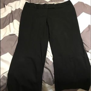 Women’s black dress pants.
